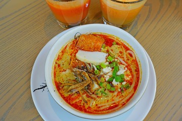 A bowl of hot Malaysian laksa soup