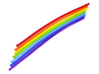 Rainbow made of twisting balloons isolated on white background.