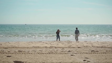 Couple walking on the beach