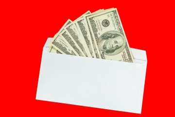 Money US dollars in an envelope on an isolated red background