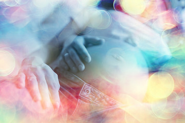 pregnancy concept childbirth and love / man and woman, big belly, hands in the shape of a heart, symbol of pregnancy and love