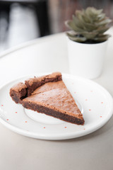 Fototapeta na wymiar Sliced of flourless dark chocolate cake