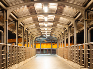 Walking on the overpass at night.