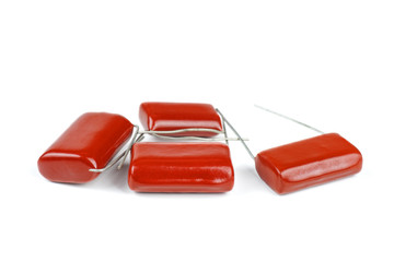 Red capacitor isolated on white background