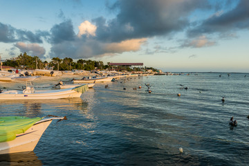 Obraz premium Boats anchored during a dramatic and beautiful sunset. Los Roques National Park, Venezuela