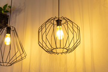 Pair of loft lanterns in dront of the wall. © Garmon