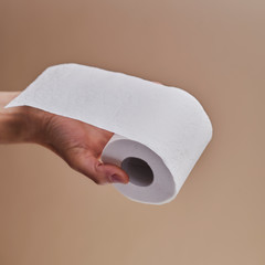man with a toilet paper roll in his hand