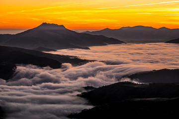 Detail of the beautiful Mount Larrun on a winter morning by the sea of clouds. Basque Country