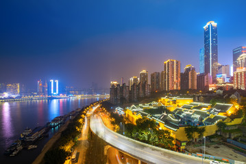 Fototapeta na wymiar Waterfront overpasses and modern urban architecture in chongqing, China