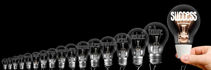 Light Bulbs with Difficulties and Success Concept