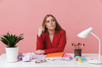 Thoughtful young woman sit at the table