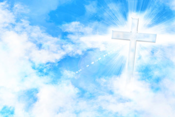 Cloudy blue sky with cross and glare