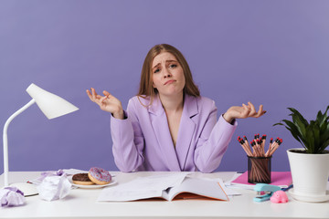 Confused woman sit at the table