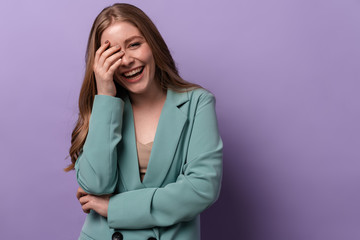 Woman laughing posing indoors isolated