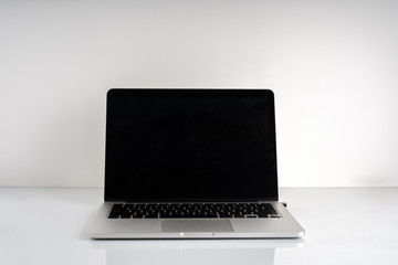 Fototapeta premium Laptop and white background with education concept.