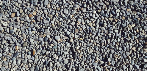 Small gravel, rock or stone on the floor or ground for background. Hard material, Art or natural wallpaper and Group of object concept