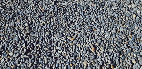 Small gravel, rock or stone on the floor for background. Hard material, Art or natural wallpaper and Group of object concept 