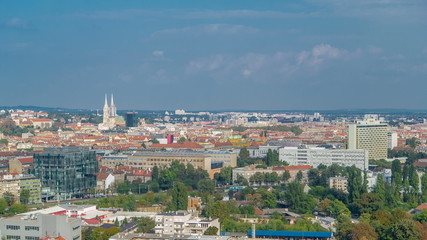 Fototapeta premium Panorama of the city center timelapse of Zagreb, Croatia, with modern and historic buildings, museums in the distance.