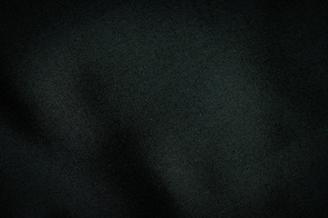 Black fabric, luxury dark gray background abstract. Material are used in textile assembly. Detail cloth texture of pattern. Design, elegance with vignette effect, free copy space for text placement.