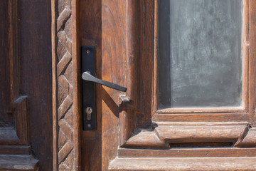 Aged wooden door with metal handle