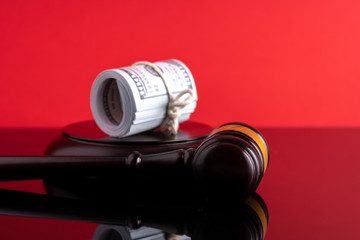 Banknotes with gavel hammer with law concept.