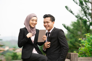 Lovely couple with corporate lifestyle and natural lighting.