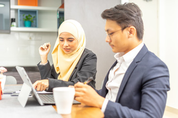 Business couple with workplace enviroment