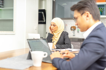 Business couple with workplace enviroment