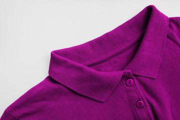 Dark purple or violet colour polo shirt. Blank plain shirt, casual stylish clothing isolated on...