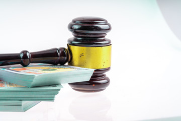 Gavel hammer and banknote with white background