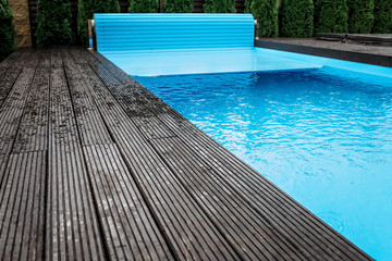Automatic swimming pool covering system, home and cottage equipment