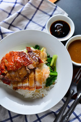 Rice roasted duck and crispy skin pork belly with gravy sauce