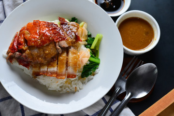 Rice roasted duck and crispy skin pork belly with gravy sauce