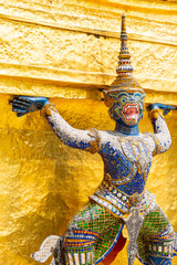 Fototapeta premium Blue monkey stucco decorated with stained glass Ramayana Story Located under the base of the Golden pagoda At the Emerald Buddha Temple, Bangkok, Thailand