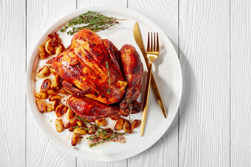 40 cloves chicken on a white platter