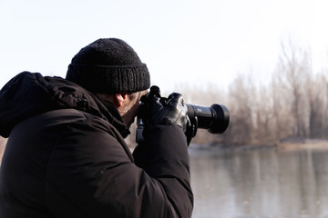 photographer with camera in nature