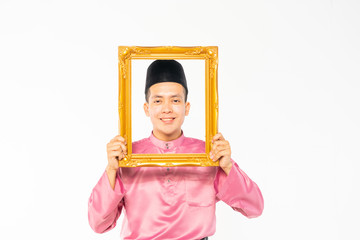 Teenager wearing traditional costume for celebration with holding pinture frame.