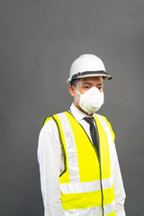 Construction worker wearing mask.