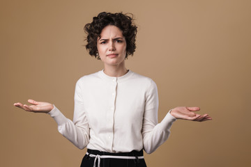 Image of annoyed caucasian woman posing and holding copyspace