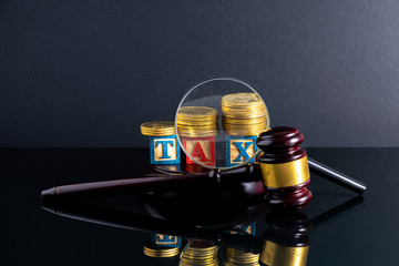 Gavel hammer and stacking coins with financial concept.