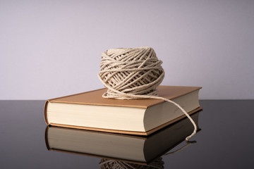 Rope and book with white background.