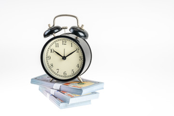 Clock and banknote with white background.