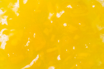 Yellow fruit jam textured background