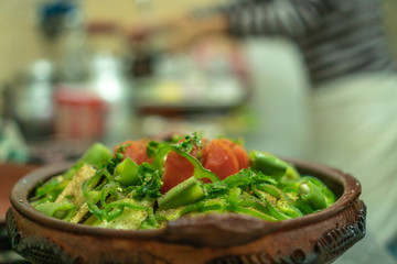 Preparation of traditional Moroccan meal - Tajine, inside the private kitchen during dinner time, Tetouan.