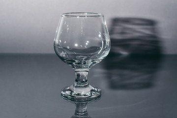 Cognac empty glass of dark gray background