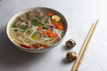 asian beige soup, flat lay, pho bo soup, vietnamese food.