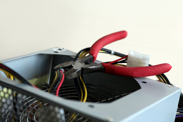 Red pliers and colored wires