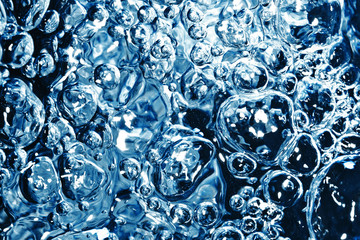 Boiling water texture. Blue fizzy water pattern. Air bubbles background.