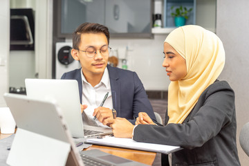 Business couple with workplace enviroment