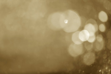 White bokeh on brown color for background.